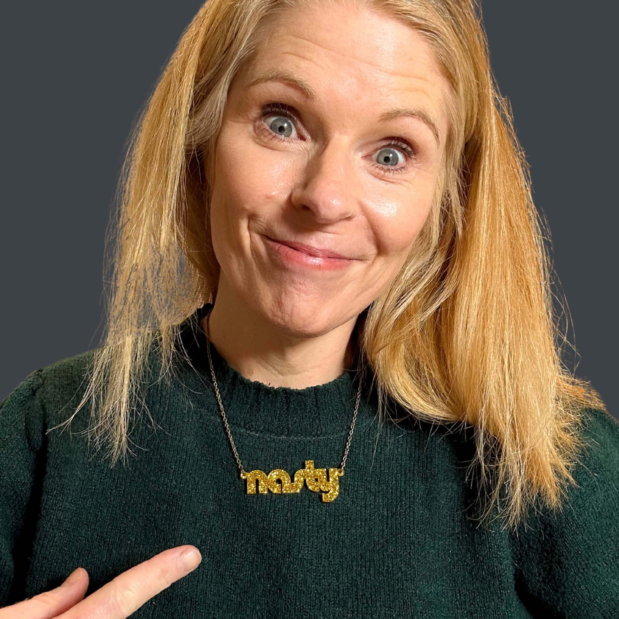 Sarah Day, founder of Wear and Resist wears an ultra gold Nasty necklace.