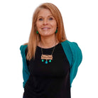 Sarah Day models the French sweary P*tain de m*rde necklace. £2 goes to Women for Refugee Women