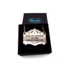 A bronze Paid up member of the Persisterhood necklace, shown in a small Wear and Resist gift box.