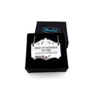 A silver Mirror Cowboy necklace etched with Paid up member of the Persisterhood, shown in a small Wear and Resist gift box.