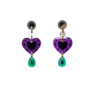 A pair of purple heart-shaped drop earrings with gold details and green gemstones at the bottom from the Suffragette Collection Women Count.