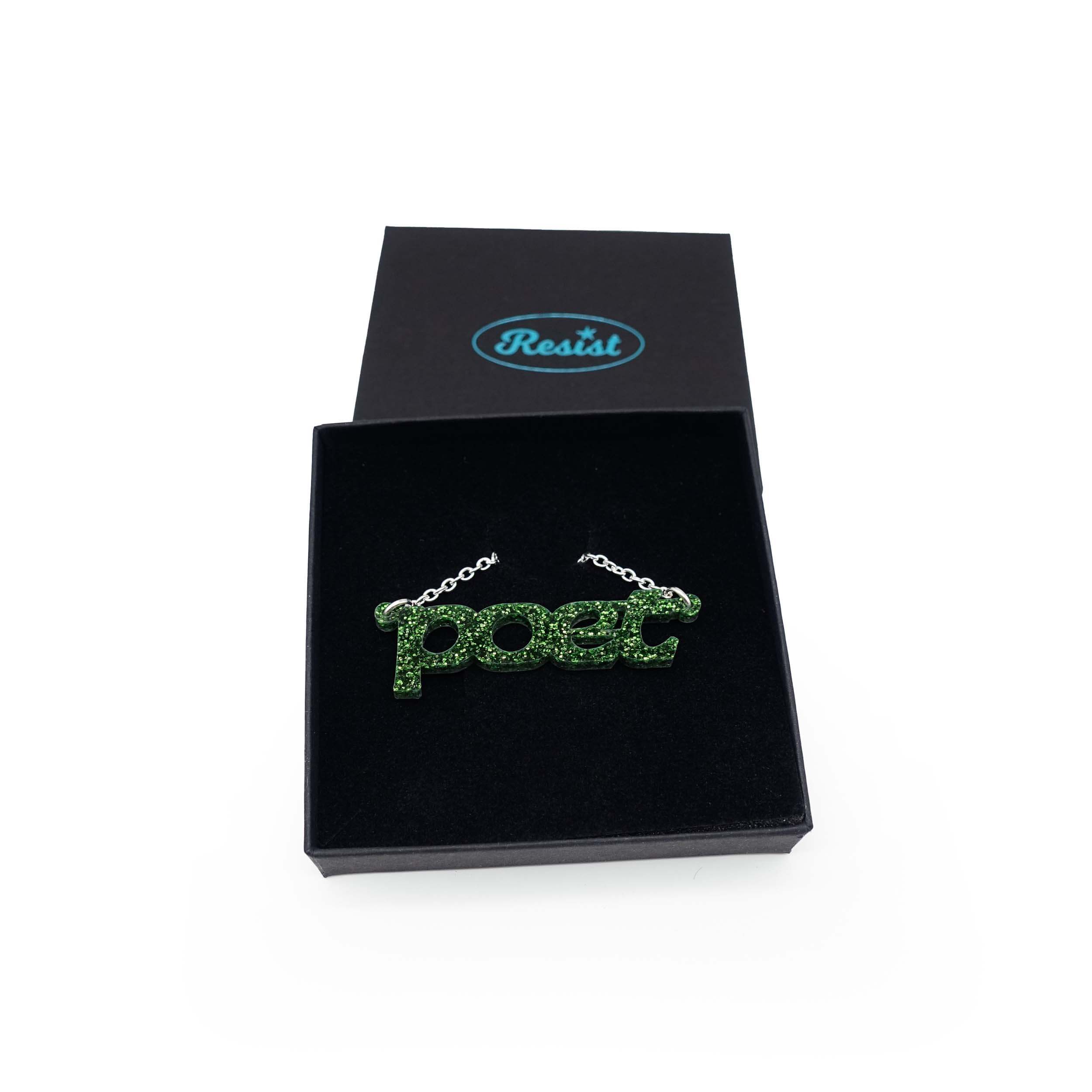 Poet necklace in moss glitter, shown in a Wear and Resist gift box.