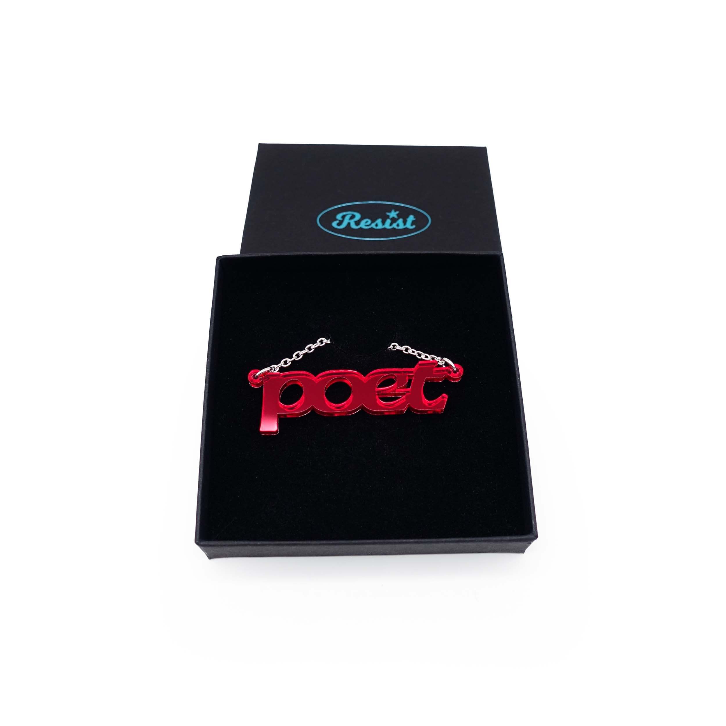 Poet necklace in ruby mirror, shown in a Wear and Resist gift box.