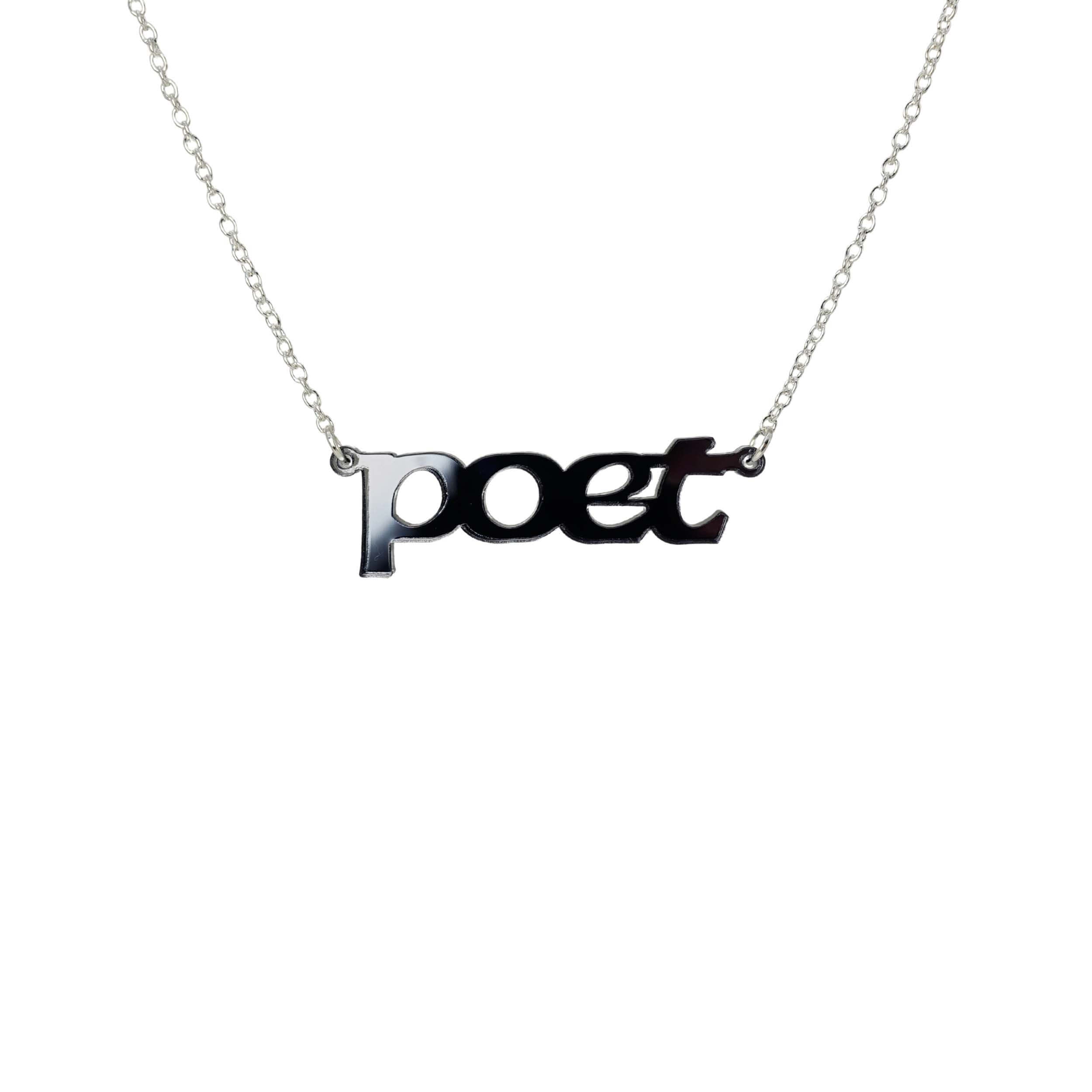 Poet necklace in slate mirror, shown hanging against a white background.