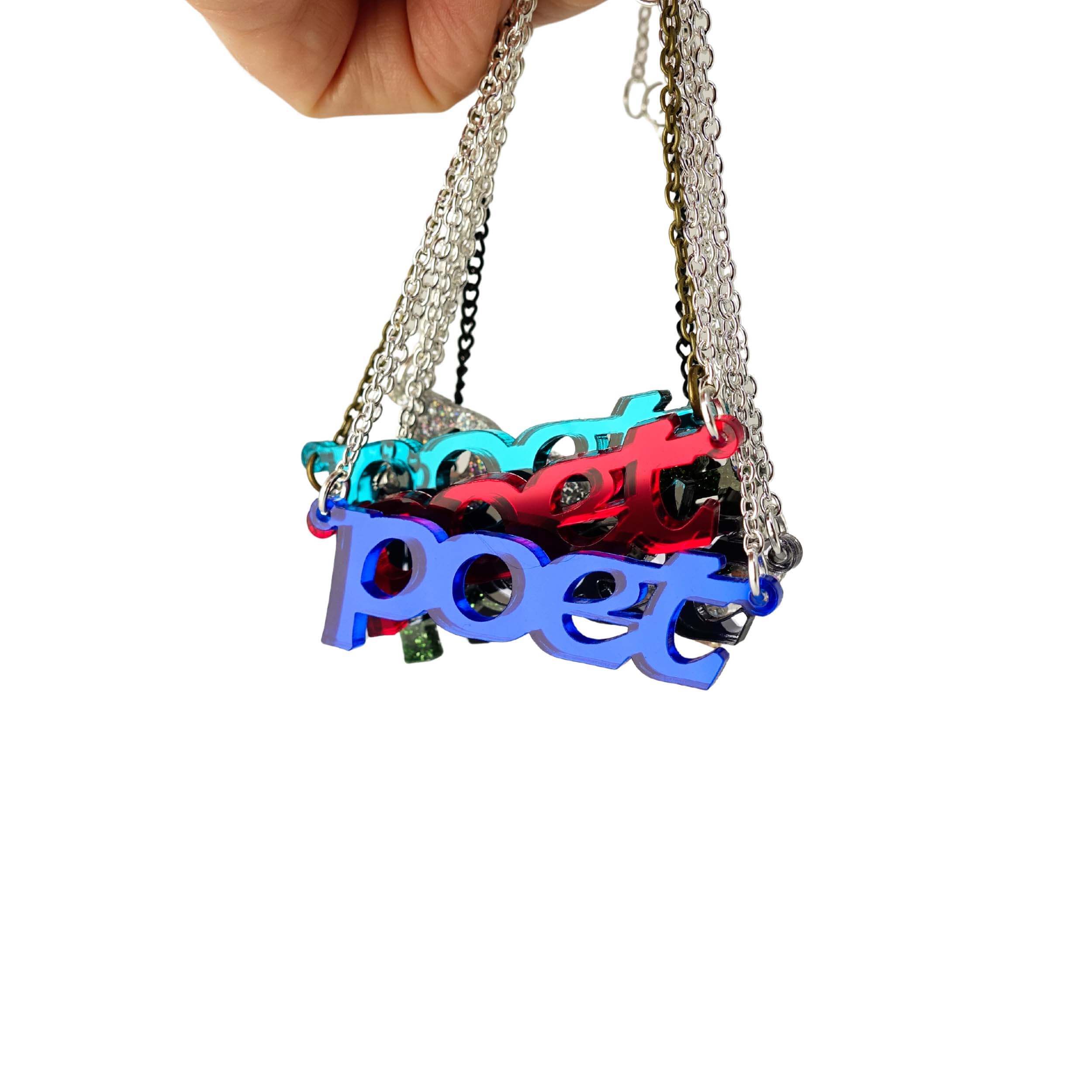 A group of Poet necklaces in different colours shown hanging together.