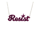 A 'Resist' necklace in purple glitter shown hanging against a white background.