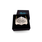 Rage, rage against the Lying of the Right mirror cowboy necklace in bronze, shown in a small Wear and Resist gift box. Dylan Thomas would be proud.