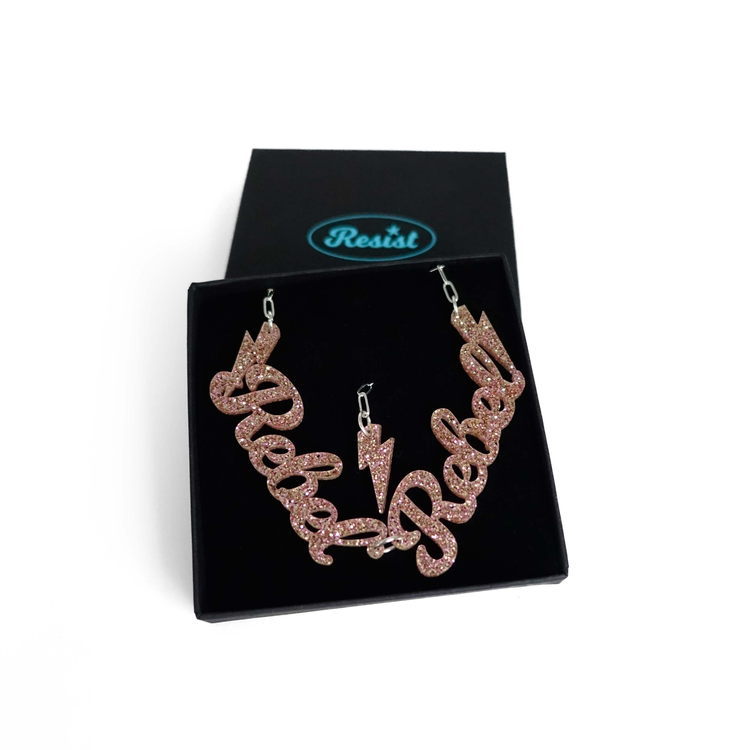 Champagne glitter Rebel Rebel necklace shown in a Wear and Resist gift box.