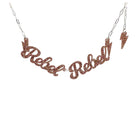 Rebel Rebel Necklace in pink fizz glitter shown hanging against a white background.