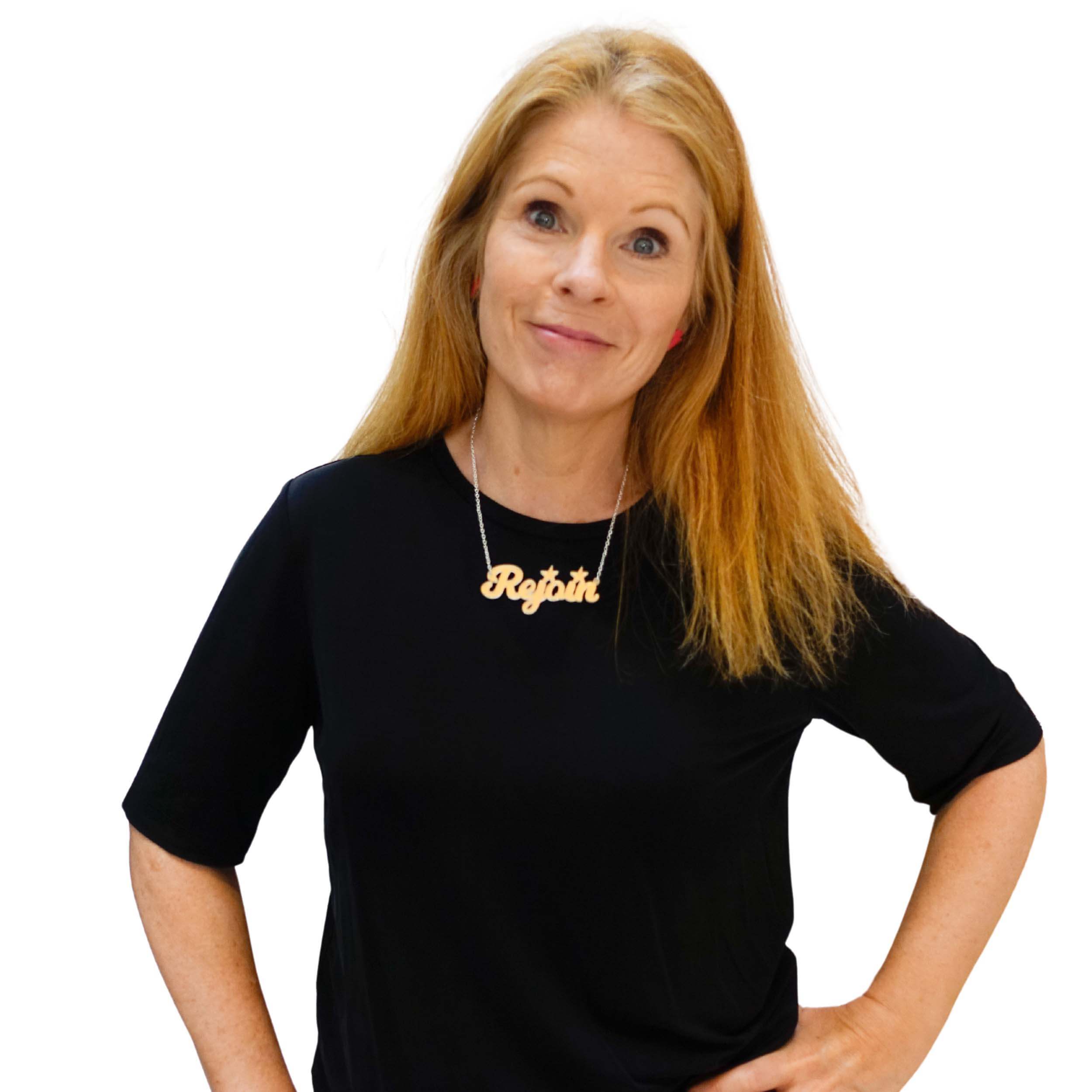 Sarah Day, founder of Wear and Resist wears a matte iridescent Rejoin the EU necklace.