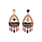 Resist and Persist statement dangly earrings in rose gold, shown cut out against a white background.