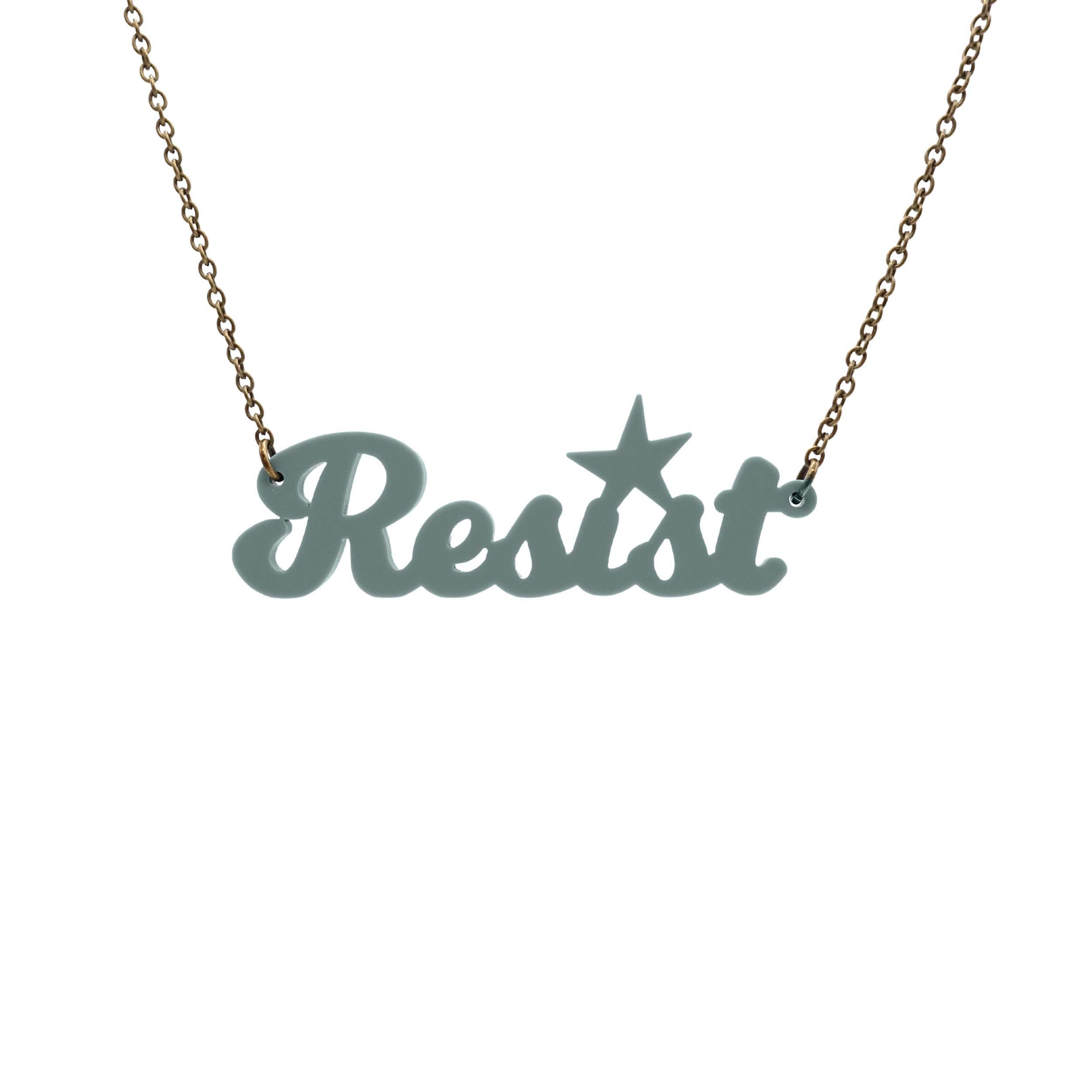 A 'Resist' necklace in duck egg green shown hanging against a white background.