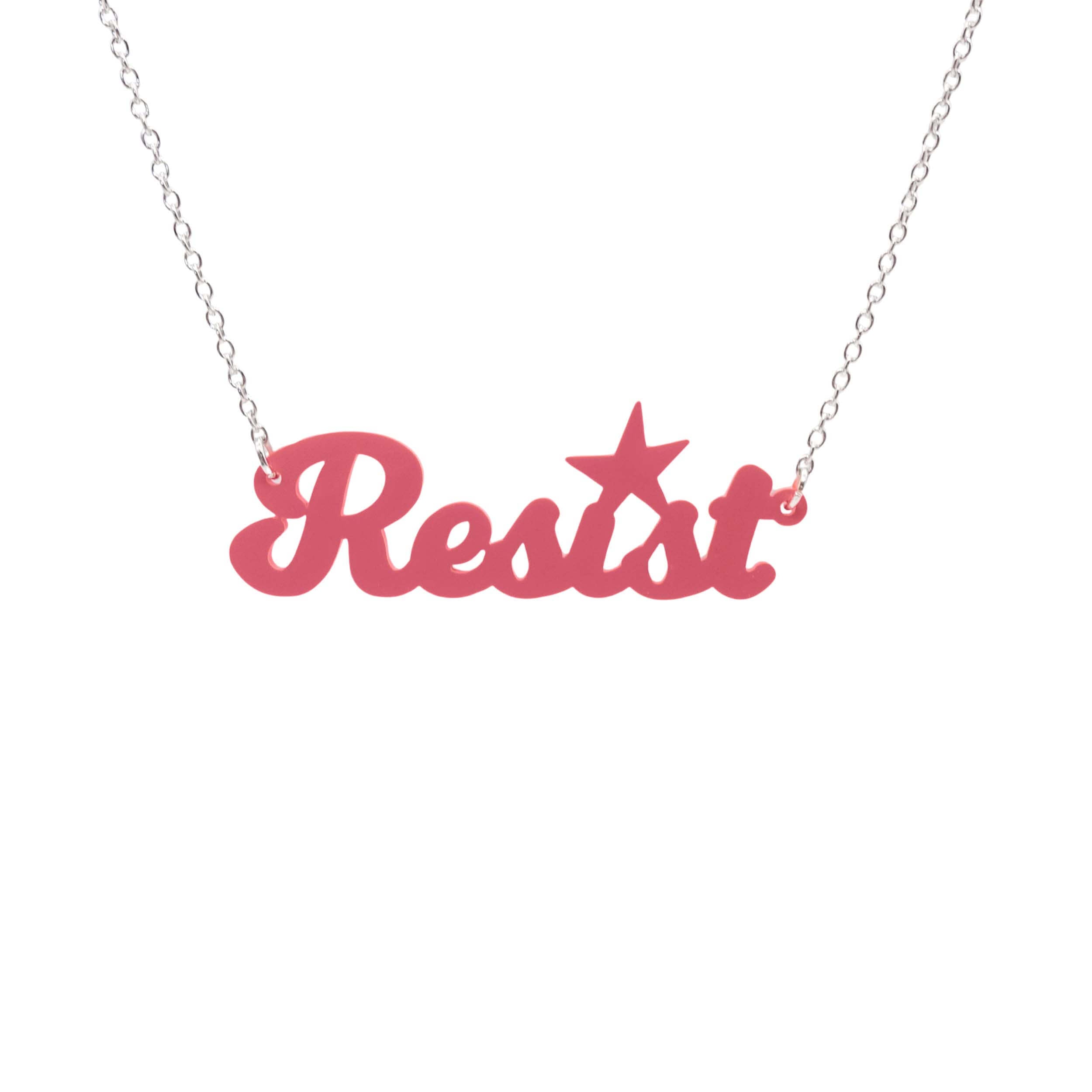 A 'Resist' necklace in sunset pink shown hanging against a white background.