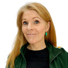 Sarah wears small electric green mirror lightning bolt hoop earrings.