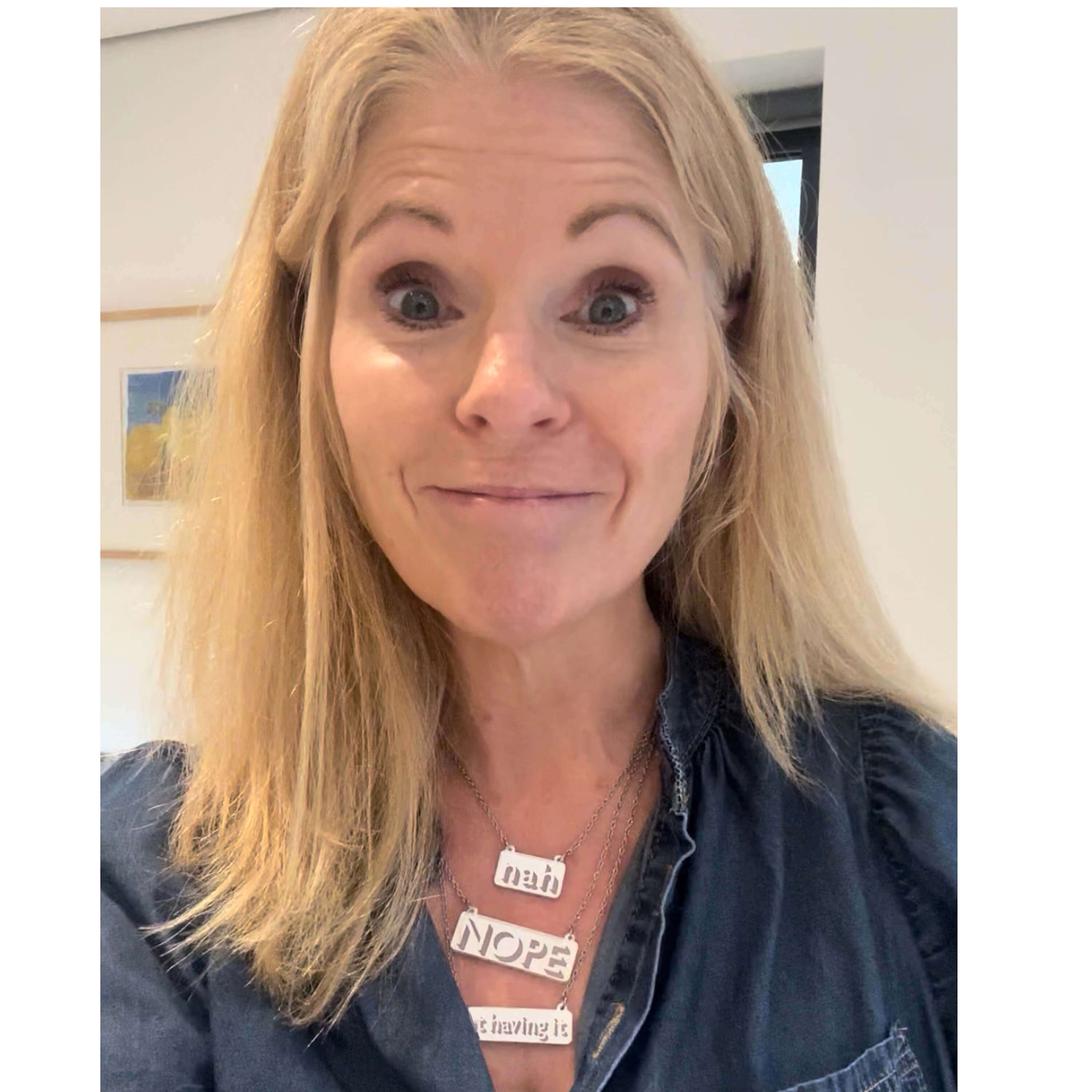 Sarah Day wears all three Nah, Nope, Not Having It silver mirror necklaces.