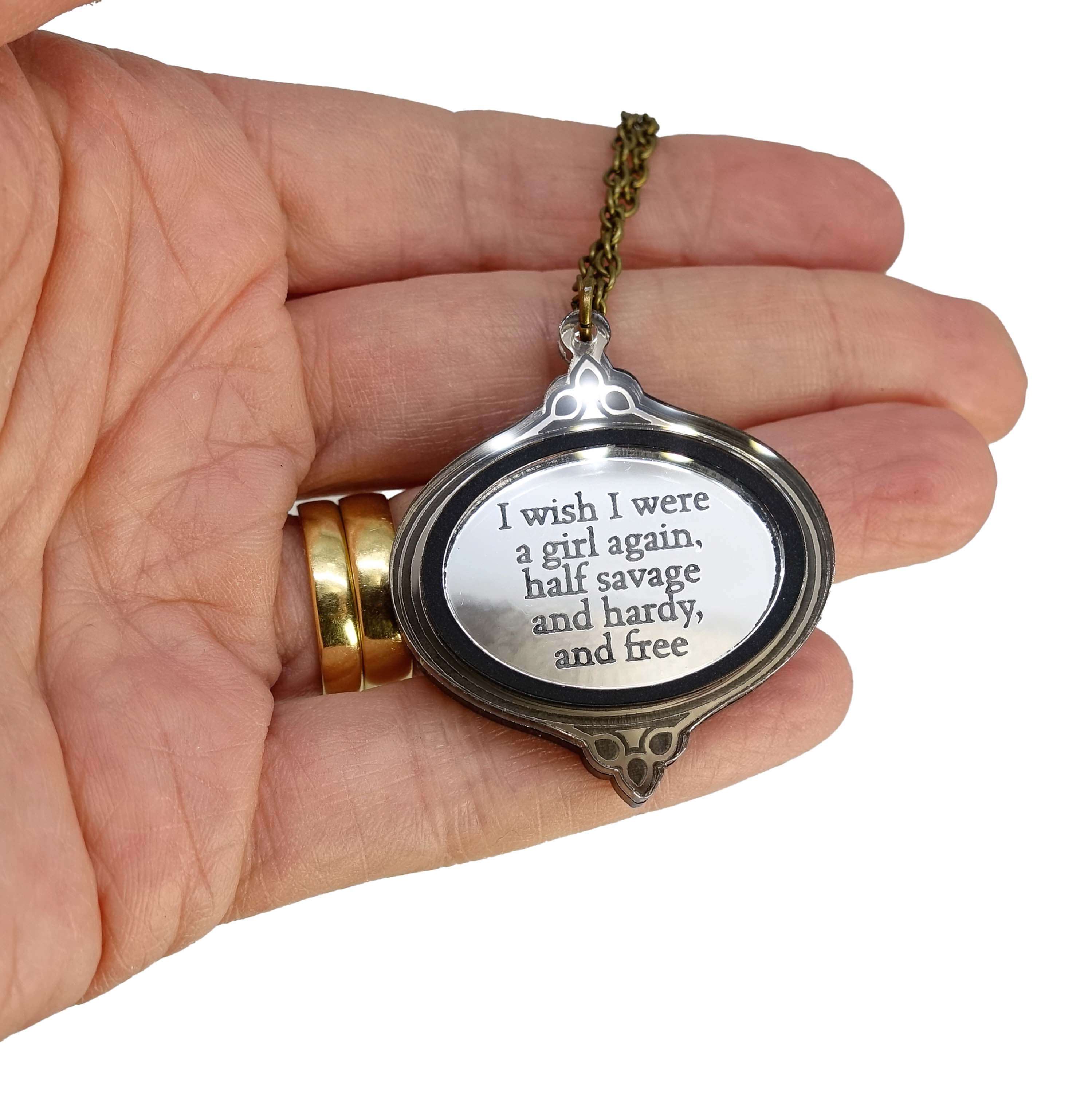 'I wish I were a girl again' Wuthering Heights necklace from the Bronte Collection, shown held in my hand.