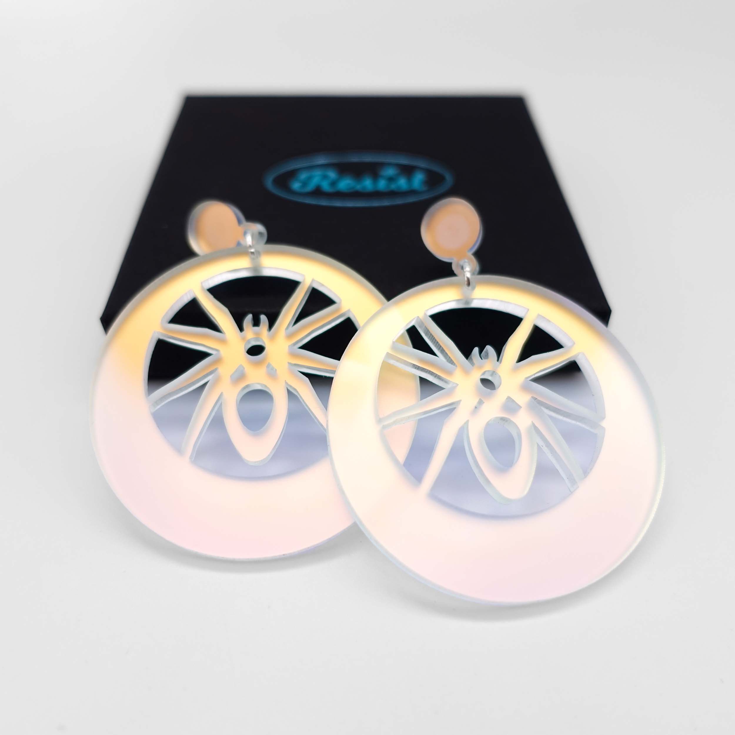 Matte iridescent spider hoop earrings, designed by Sarah Day for Wear and Resist.