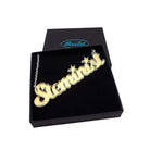 Steminist necklace for women working in STEM in matte iridescent shown in a Wear and Resist gift box.