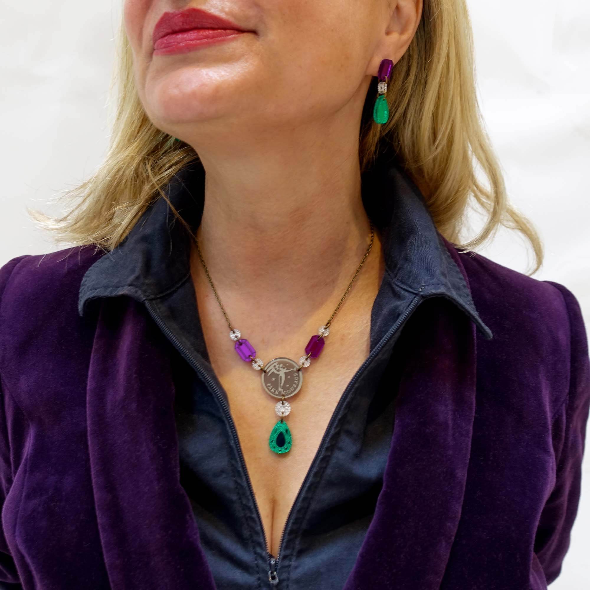 Andrea wears the Angel of Freedom necklace with Suffragette drop earrings.