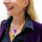 Andrea wears the Take Courage heart drop necklace with matching heart drop earrings.