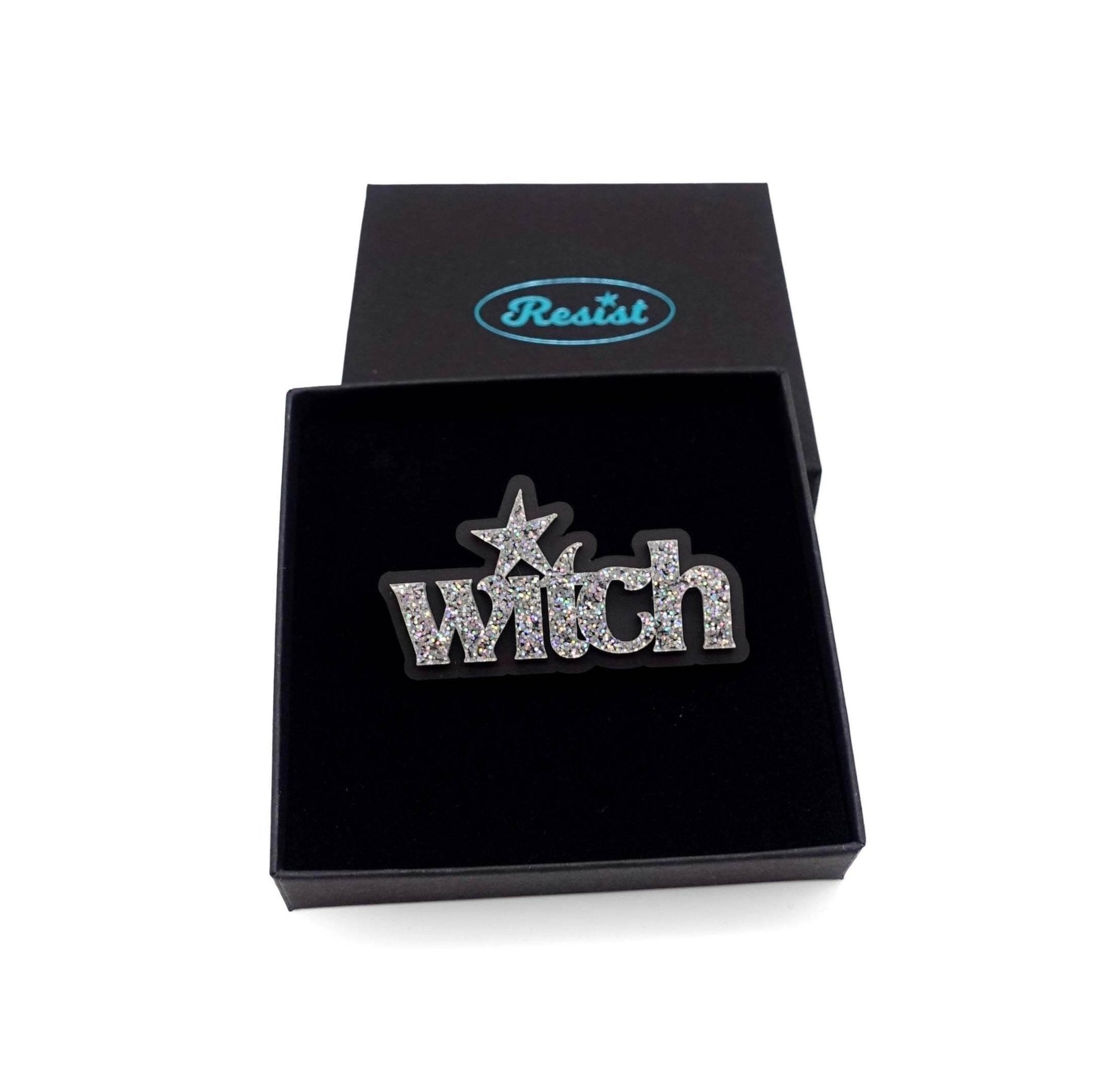 Witch brooch in silver glitter, shown in a Wear and Resist gift box.