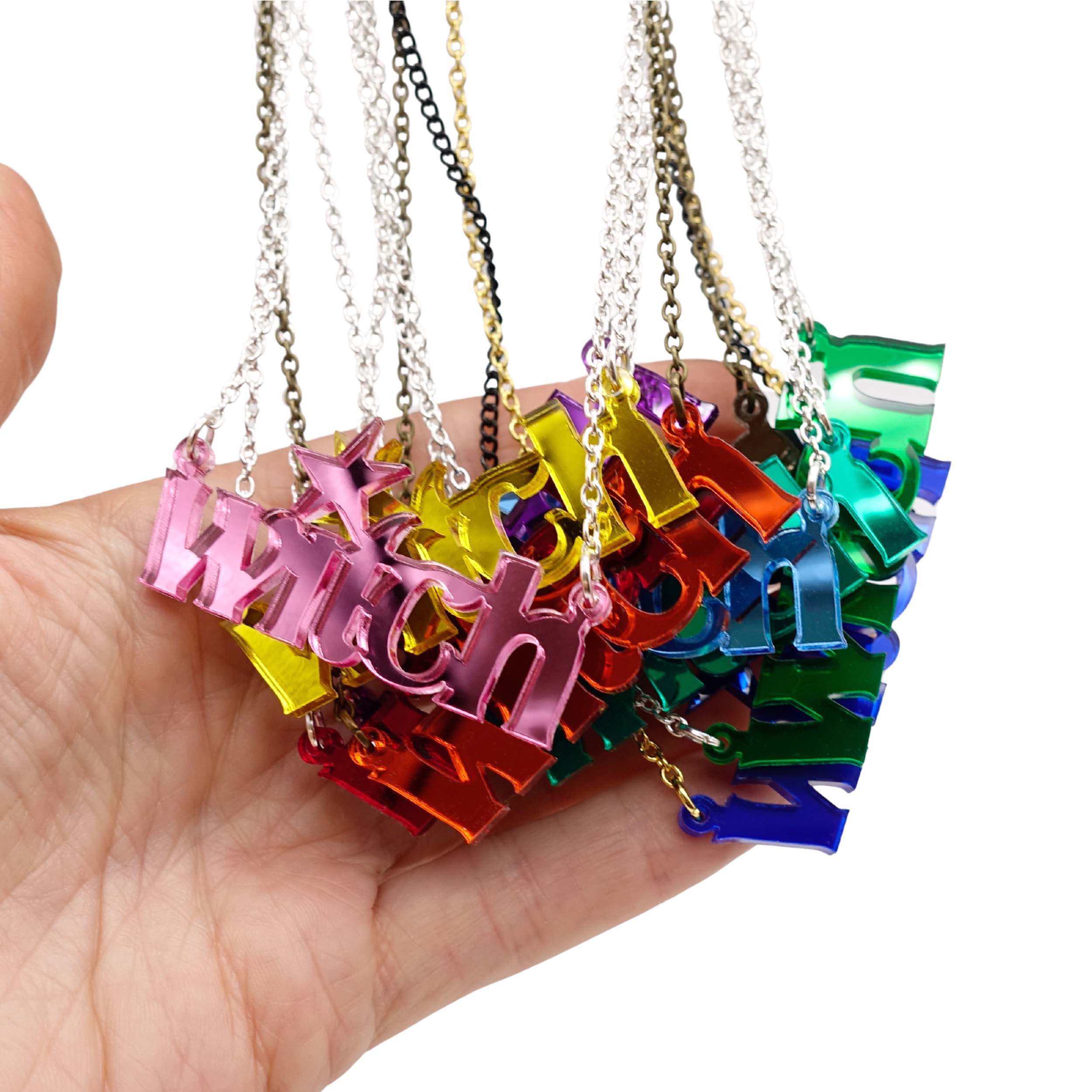 A handful of Witch necklaces in all the different mirror colours.