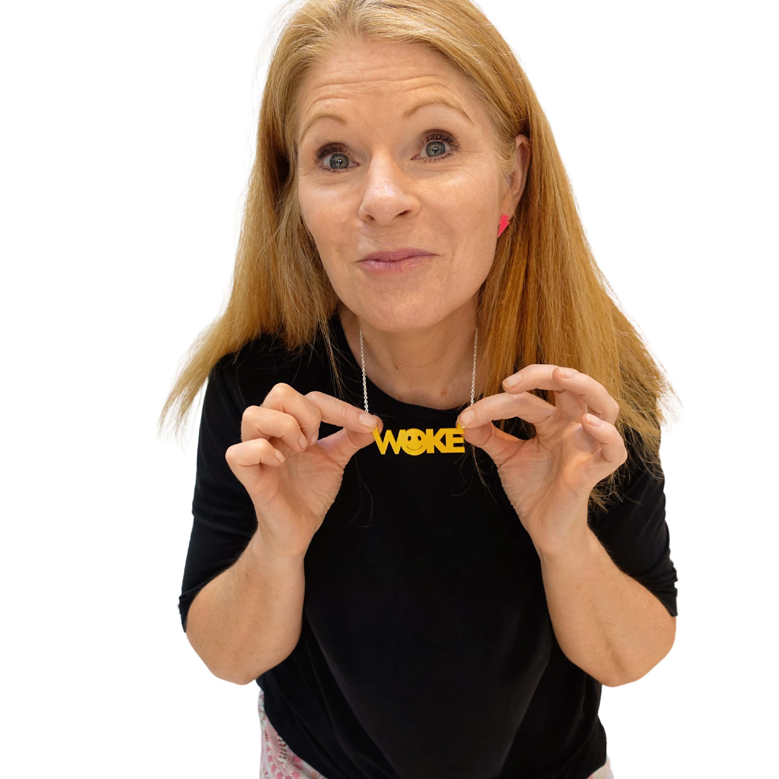 Sarah Day wears a yellow WOKE necklace.