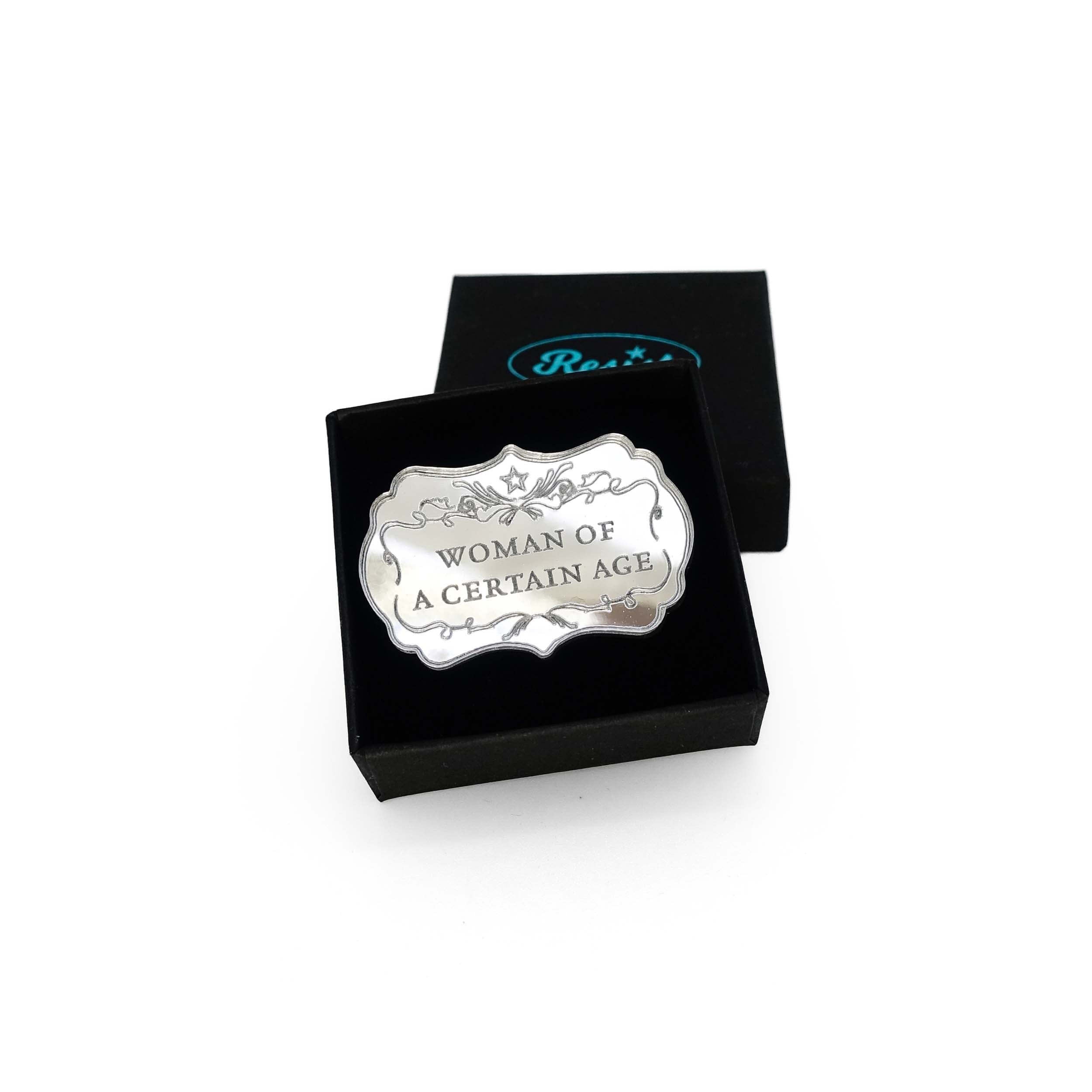 Silver mirror Woman of a Certain Age brooch shown in a small Wear and Resist gift box.