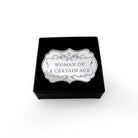 Woman of a Certain Age brooch shown in a Wear and Resist gift box.