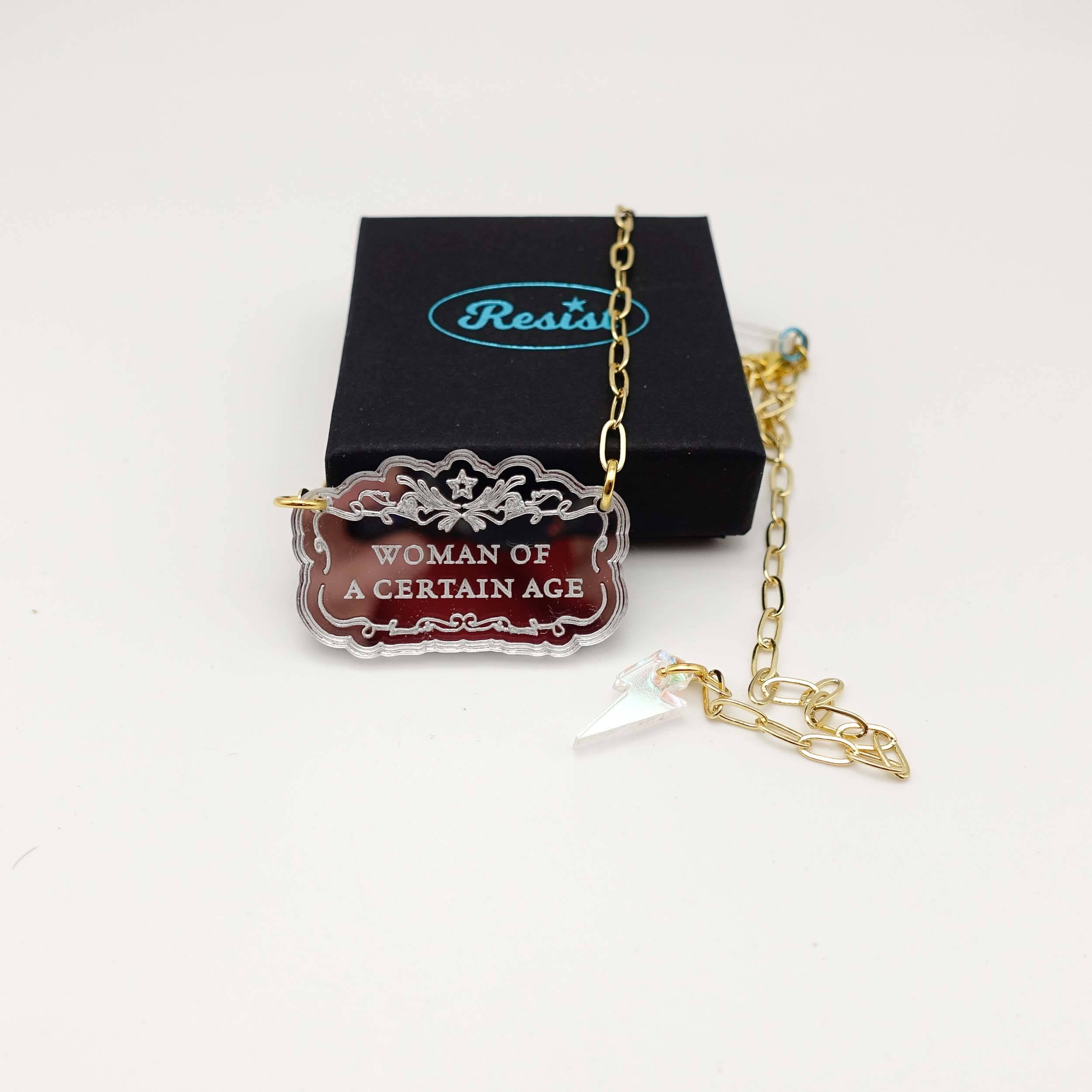 Woman of a Certain Age necklace shown with a small Wear and Resist gift box.