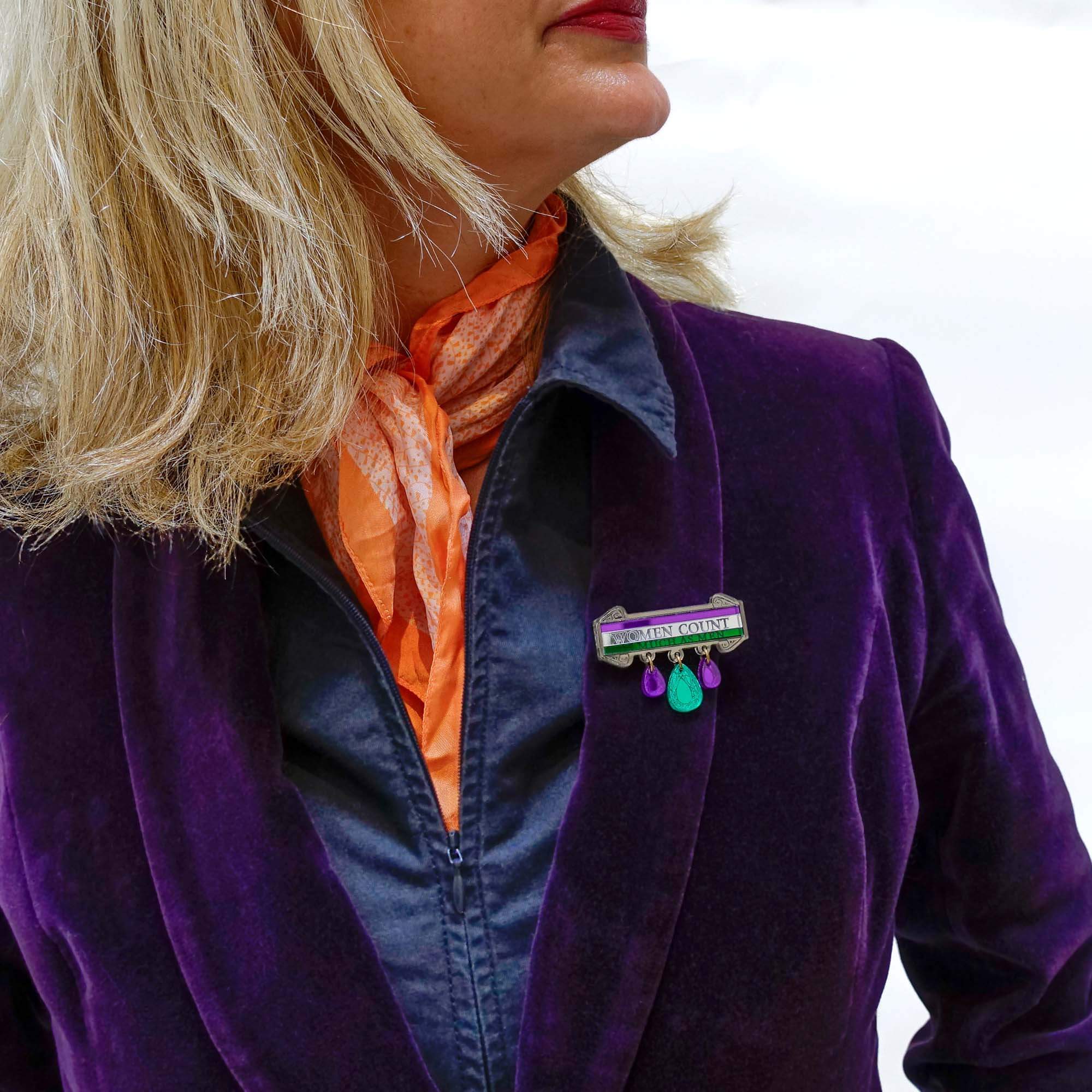 Andrea wears the Women Count jewel brooch.