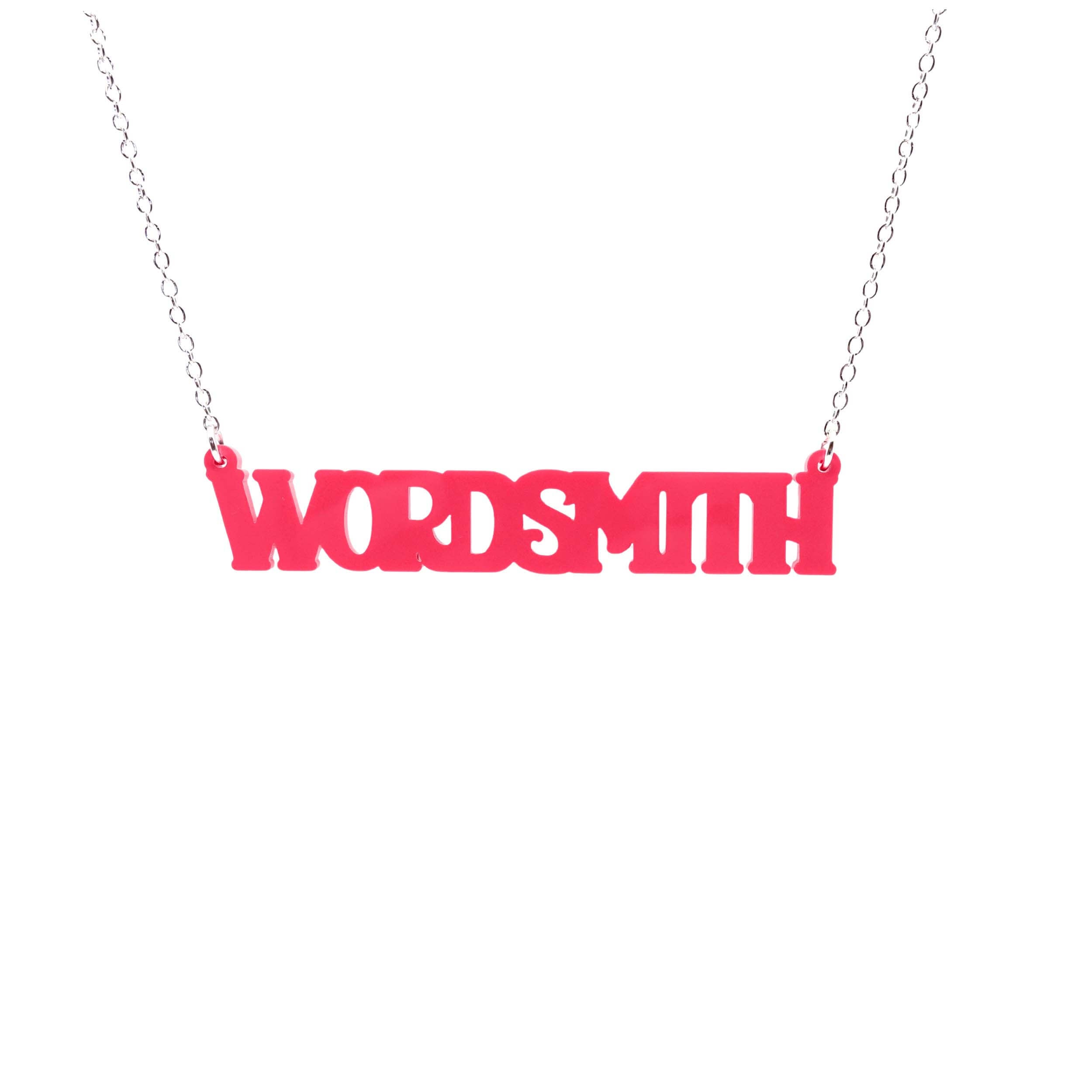 A necklace that says 'Wordsmith' in hot pink, shown hanging against a white background.