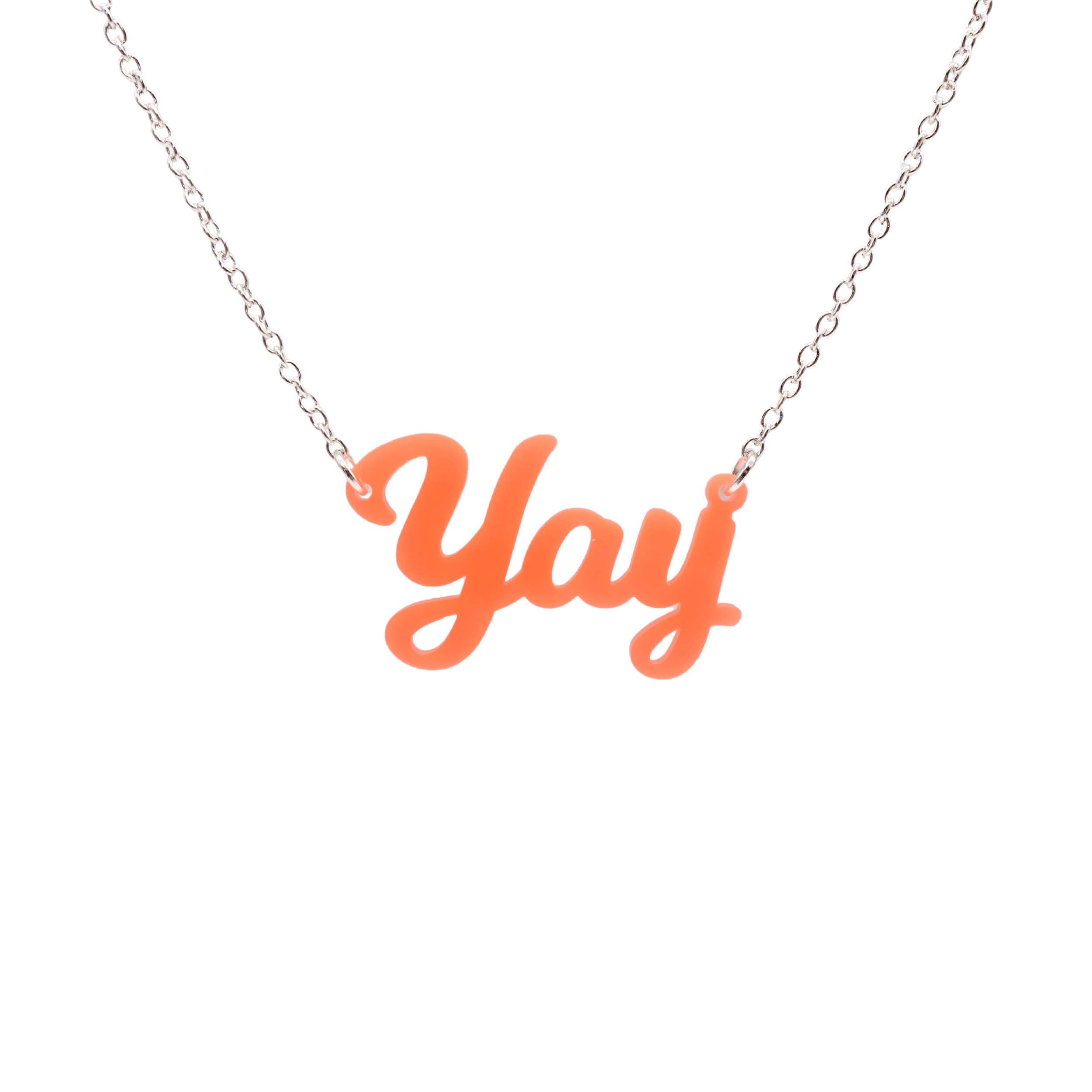 Yay necklace in fluoro orange shown hanging against a white background.