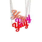 A group of Yay necklaces with matte iridescent in front shown hanging against a white background.