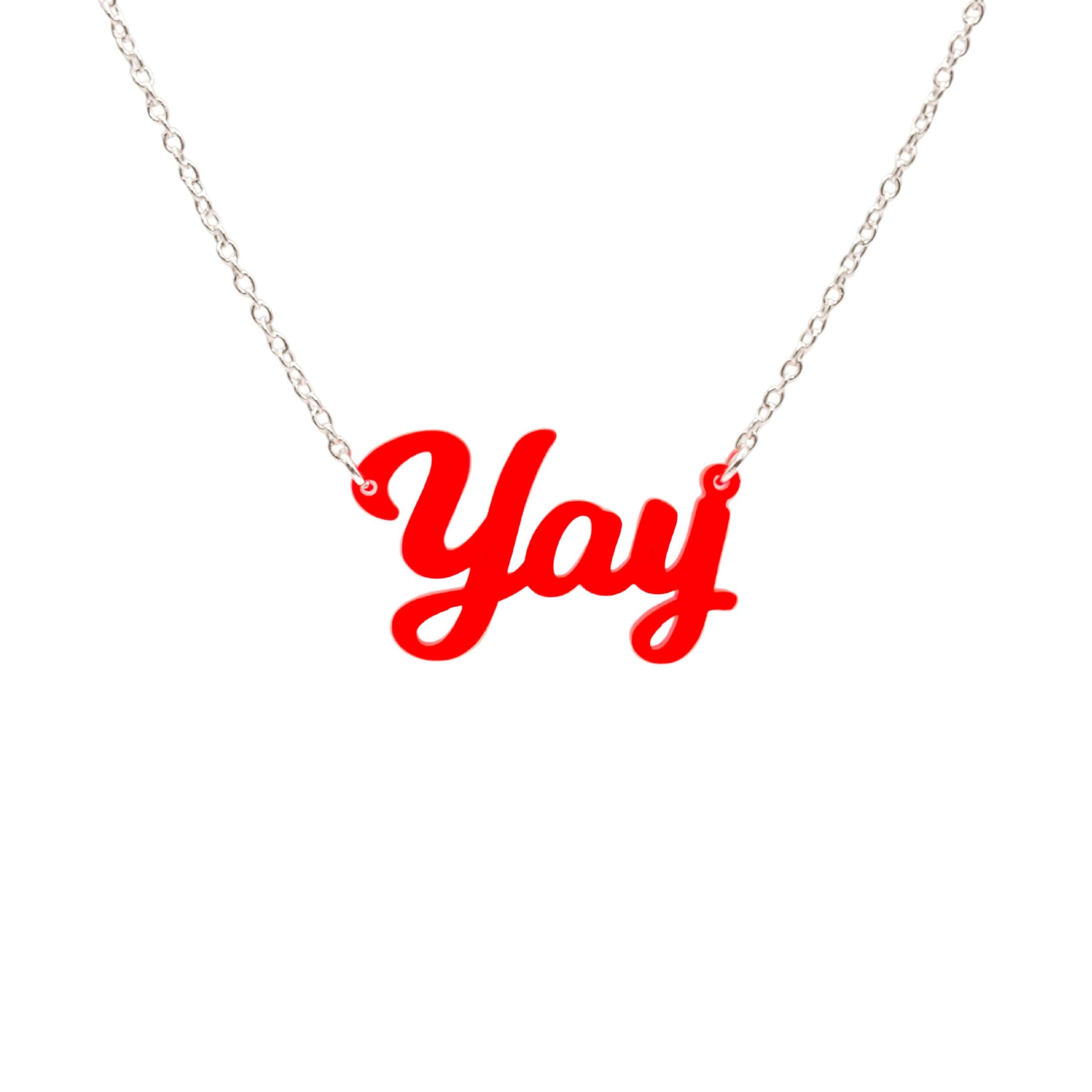 Yay necklace in hot red shown hanging against a white background.