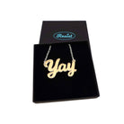 Yay necklace in matte iridescent shown in a Wear and Resist gift box.