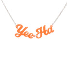 A flouro orange Yee Ha necklace shown hanging against a white background.