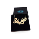 A matte iridescent Yee Ha necklace shown in a Wear and Resist gift box.
