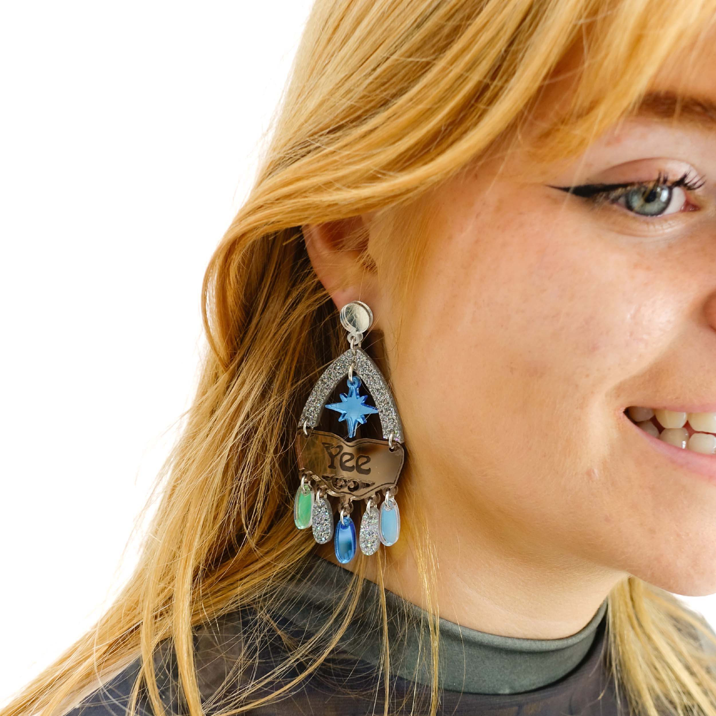 Eliza wears the Sky Cowgirl Yee Ha Western inspired statement earrings.