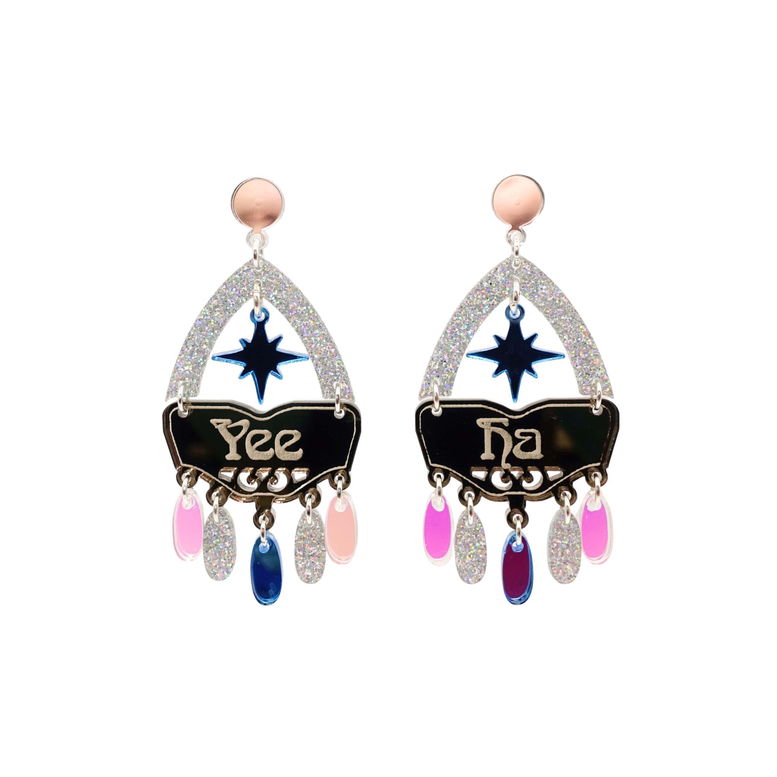 Western style statement earrings in sparkly silver glitter with the words Yee Ha engraved on them and a sky blue star.