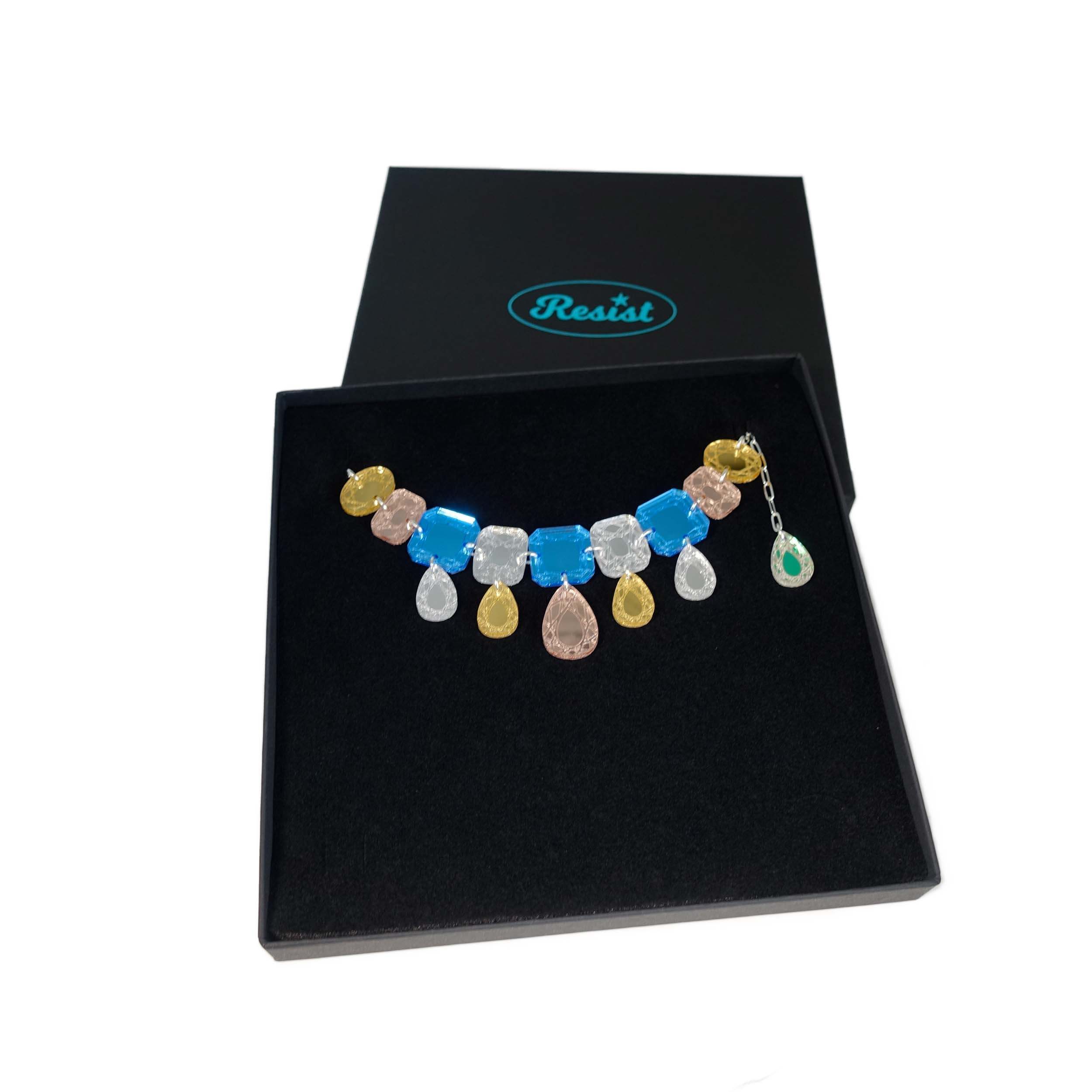 Austerity jewels necklace in soft blue colours, shown in a Wear and Resist gift box. 