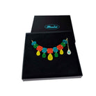 Belle Epoque jewel necklace in flame mambo colours, shown in a large Wear and Resist gift box.
