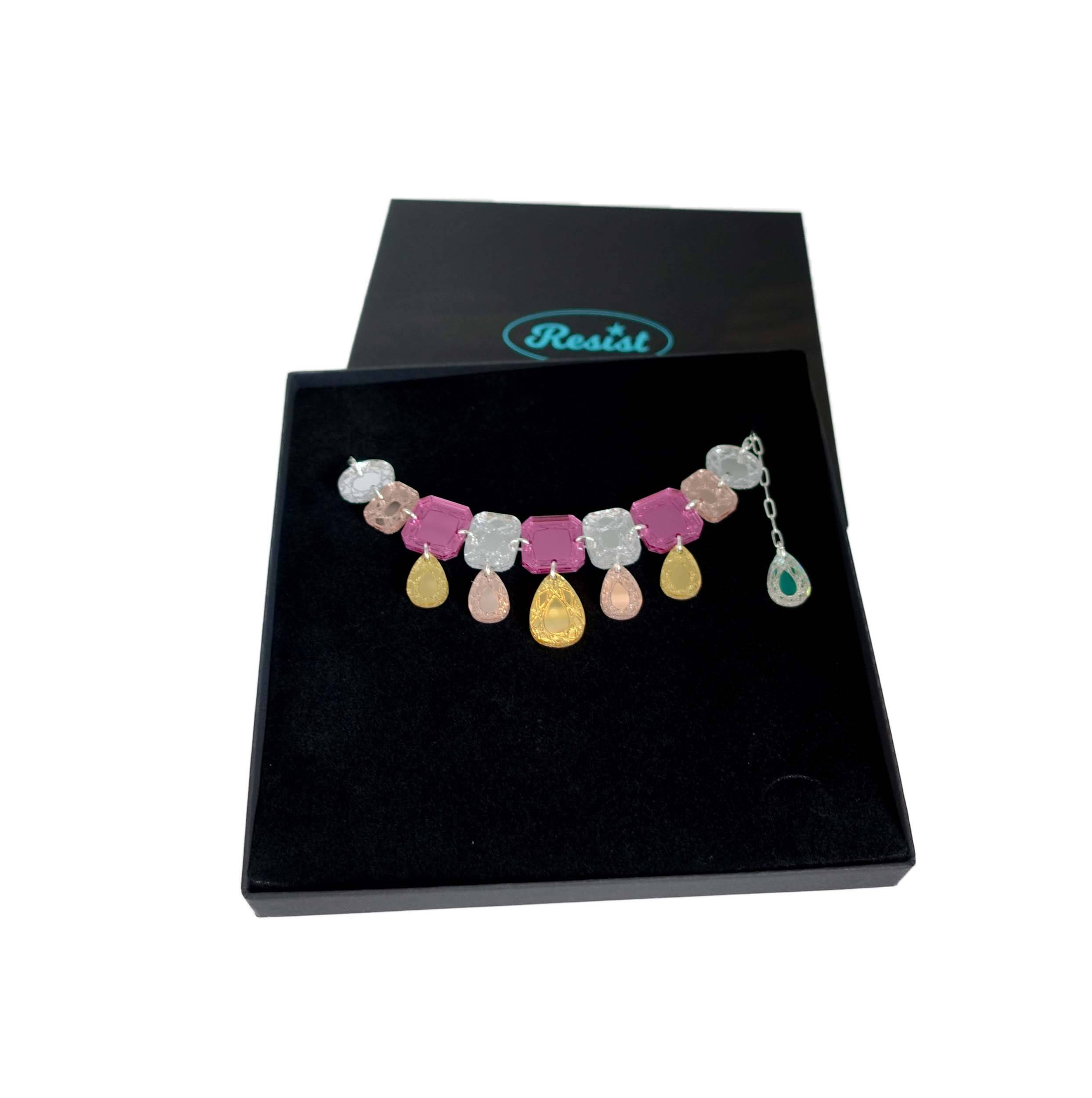 Austerity jewels necklace in golden pink colours, shown in a Wear and Resist gift box. 