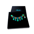 Belle Epoque jewel necklace in teal époque colourway, shown in a large Wear and Resist gift box.