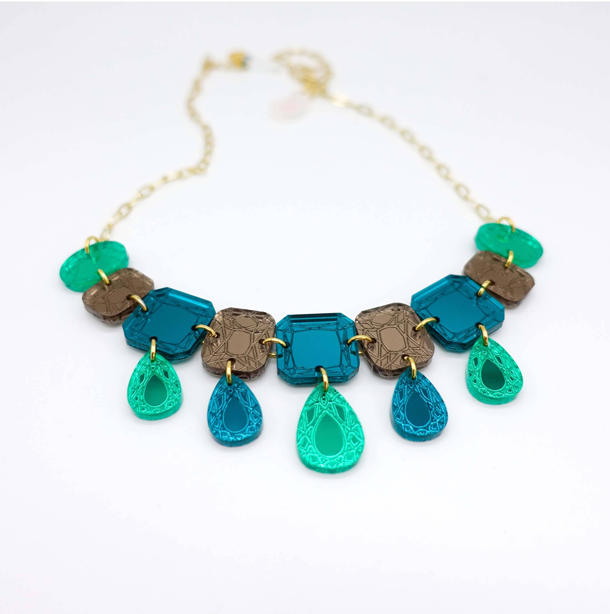 Belle Epoque jewel necklace in teal époque colourway, designed by Sarah Day for Wear and Resist. £2 goes to Women for Refugee Women. Affordable bling!