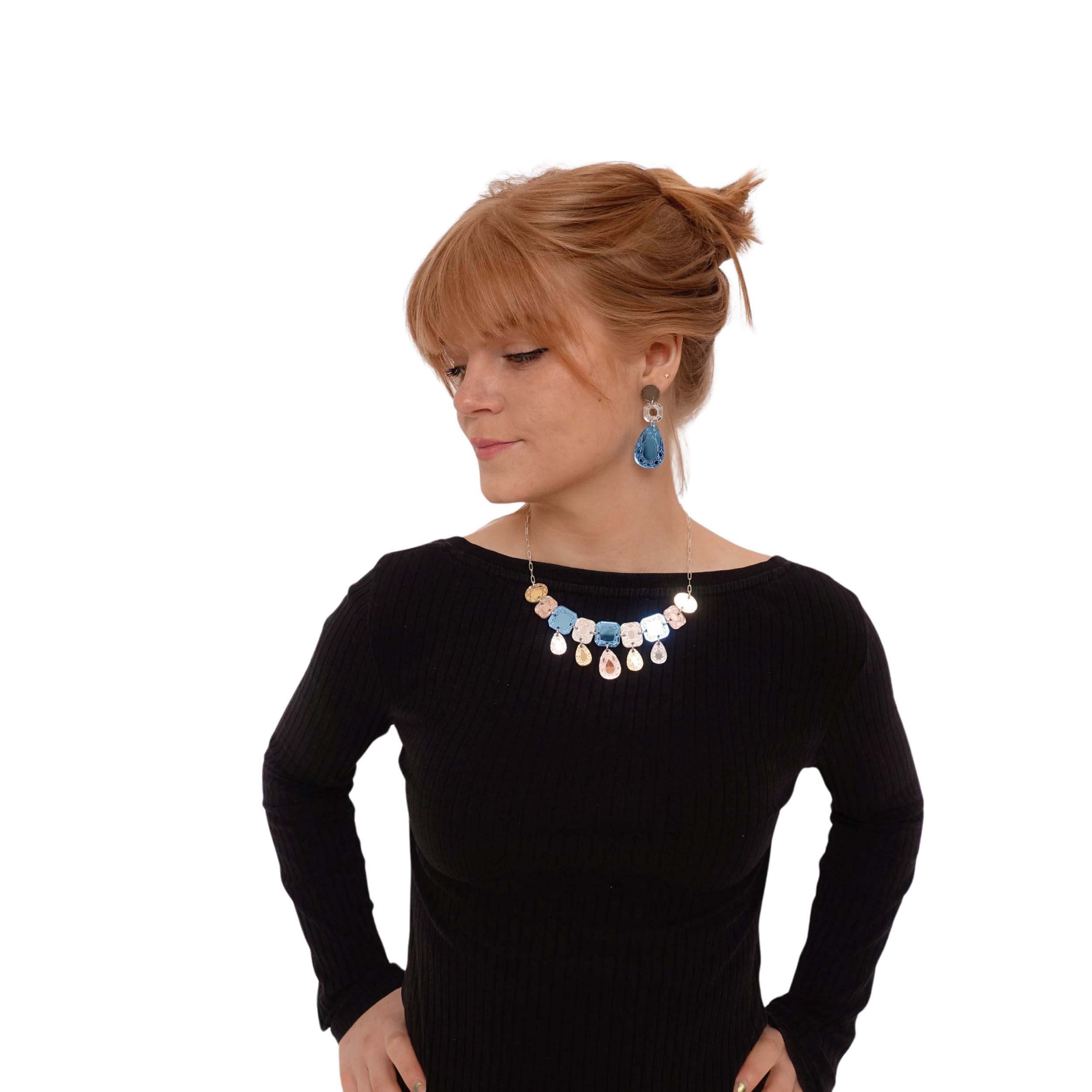 Eliza wears a Belle Epoque jewel necklace in soft blue colours, and matching large Belle Époque Jewel drop earrings. Timeless elegance in an age of cruel austerity.