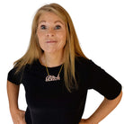 Sarah Day wears a B*tch necklace in pink fizz glitter.