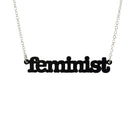 Matte black  Feminist necklace shown hanging on a white background.