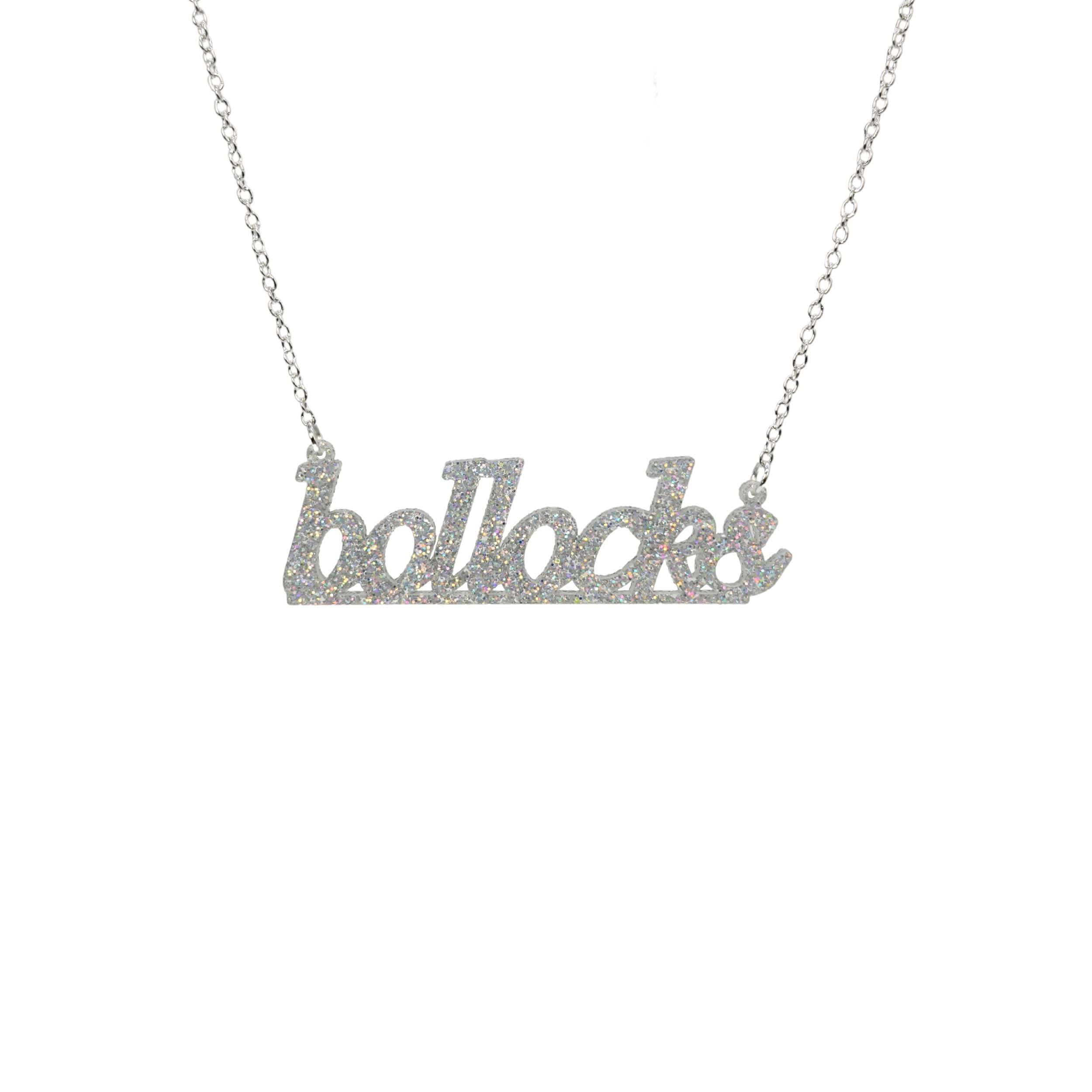 Bollocks necklace in silver glitter shown hanging against a white background.
