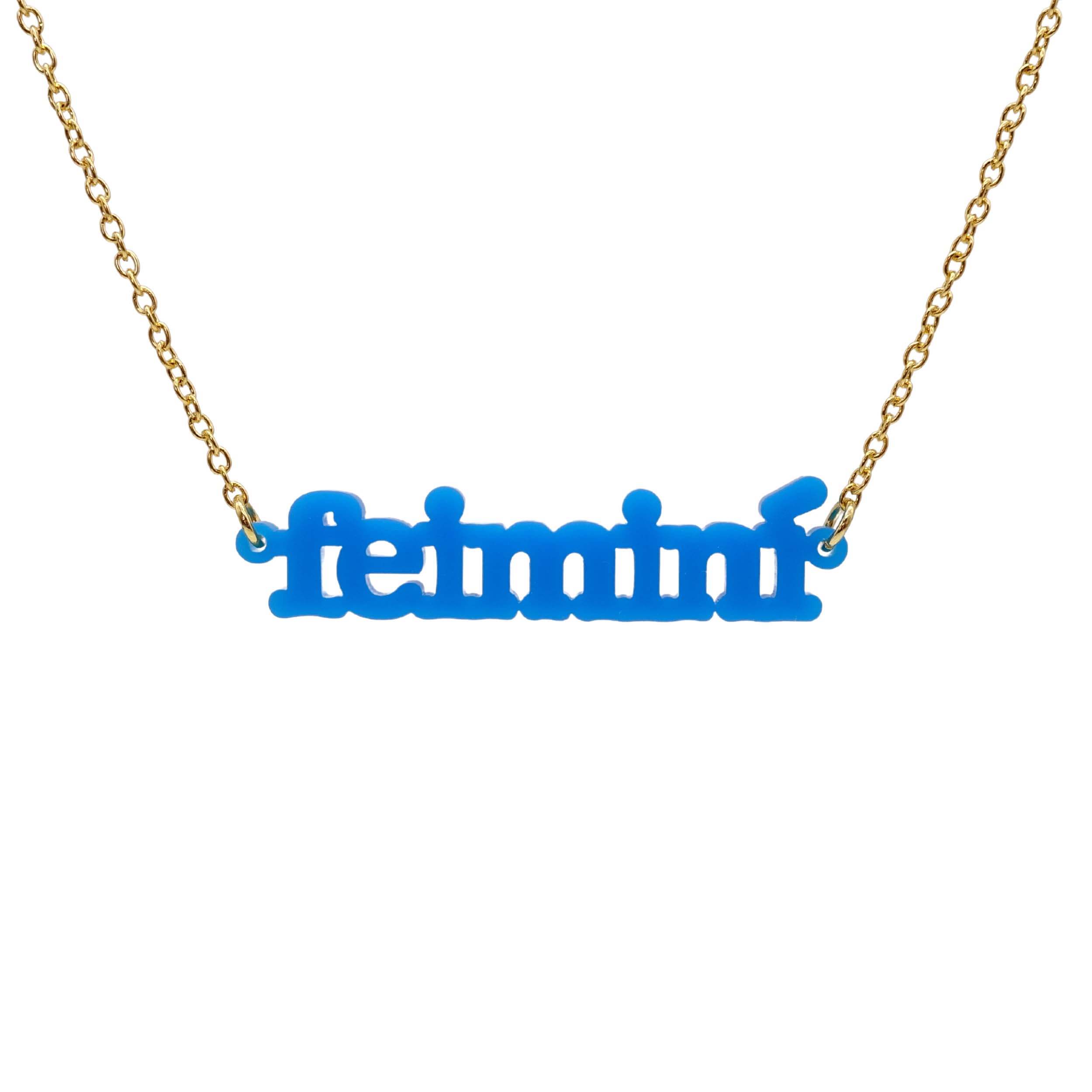 Irish Gaelic Feiminí necklace in matte bright blue, shown hanging against a white background.